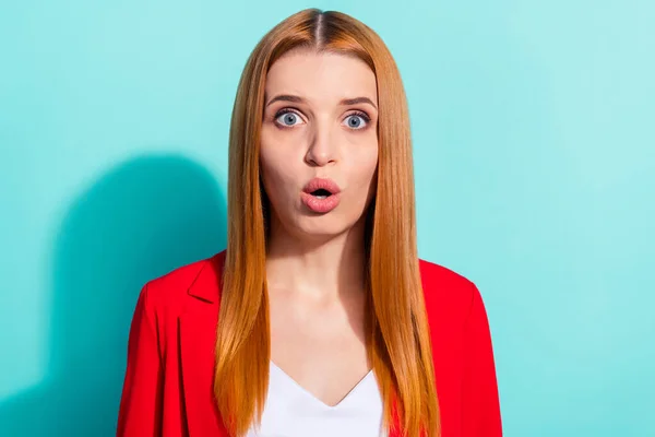 Photo of serious shocked orange hair lady wear red blazer big eyes isolated cyan color background — Stockfoto