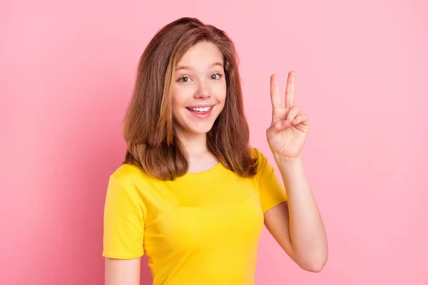 Photo of young attractive girl happy positive smile show peace cool v-sign isolated over pink color background — Stockfoto