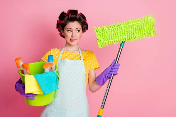 Portrait of uncertain girl hold window washer mop bucket spray look think thoughts isolated over pastel color background — Stock Photo, Image