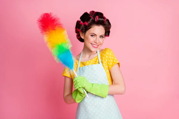 Portrait of positive wife hold soft brush duster wear yellow t-shirt green gloves isolated on pastel color background