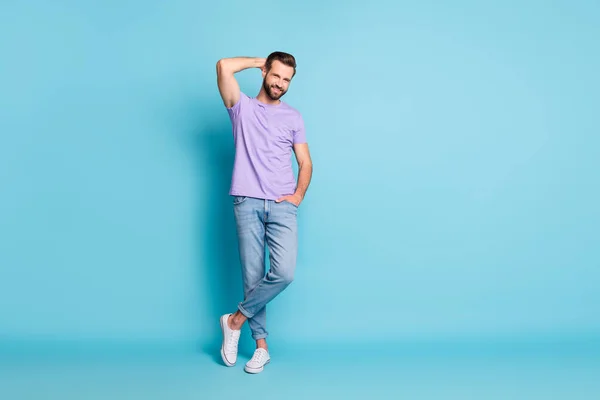 Full length photo of young handsome man happy smile confident successful isolated over blue color background — 图库照片