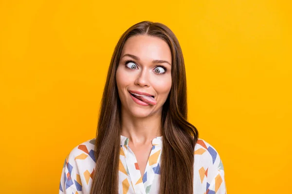 Photo of young attractive girl have fun crazy grimace tongue-out watch in different ways isolated over yellow color background — Stockfoto