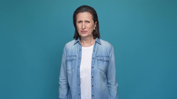 Frustrated lady not like smell hide nose isolated blue color background — Stock Video