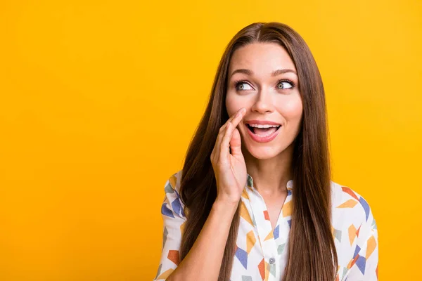 Photo of pretty funny curious lady hand near mouth say tell news gossips isolated over yellow color background — Stockfoto