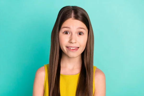 Photo of optimistic nice brown hair girl tongue out wear yellow dress isolated on bright teal color background — Fotografia de Stock