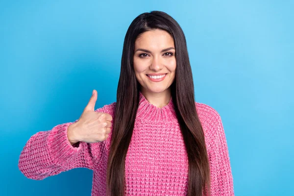 Photo of satisfied glad lady show thumb up toothy smile look camera wear sweater isolated on blue color background — Fotografia de Stock