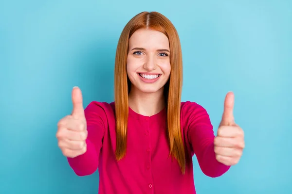 Photo of pretty adorable young lady dressed pink outfit smiling showing two thumbs up isolated blue color background — Fotografia de Stock