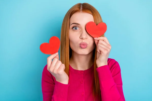 Portrait of attractive funny cheerful girl closing eye with paper heart card pout lips isolated over vivid blue color background — Fotografia de Stock