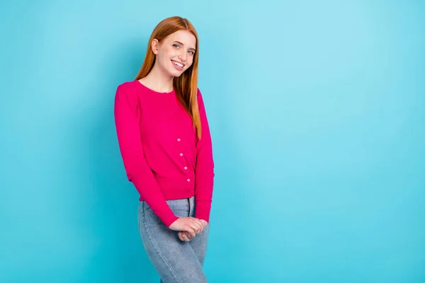 Photo of young not confident millennial foxy hair lady hold hands wear pink sweater isolated on blue color background — стоковое фото