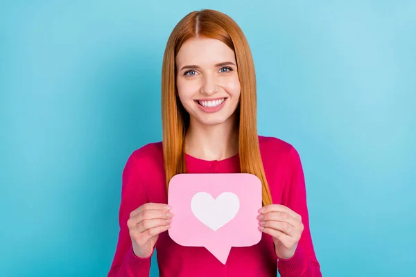 Portrait of attractive cheerful red-haired girl holding in hands like paper card isolated over vivid blue color background — Fotografia de Stock