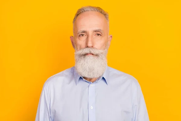 Photo of serious old grandfather calm peaceful face businessman isolated on bright yellow color background — Stockfoto