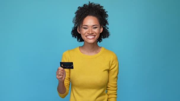 Lady hold plastic card fist up achieve success isolated blue color background — Stock Video