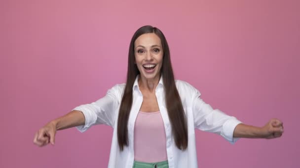 Delighted lady dance fists up isolated pastel color background — 图库视频影像