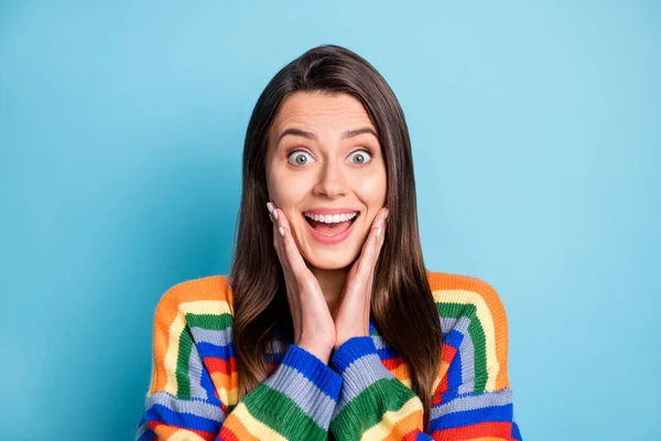 Photo portrait of shocked woman touching cheeks opened mouth staring isolated on bright blue color background — Foto Stock