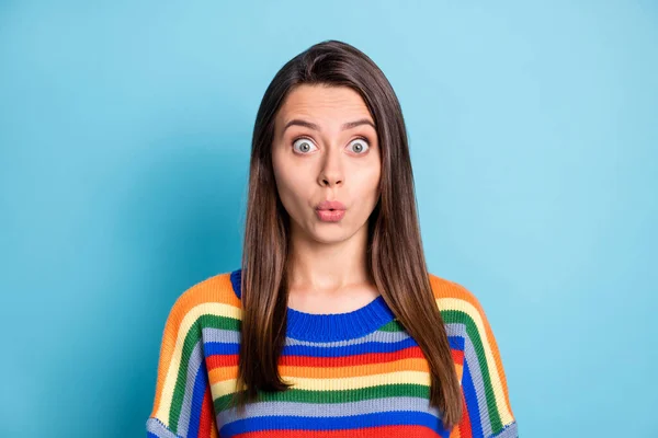 Photo portrait of shocked woman whistling in striped outfit staring isolated on vibrant blue color background — Foto Stock