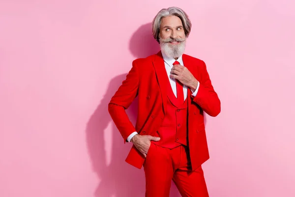 Photo of charming pretty retired man wear red suit arm tie looking empty space isolated pink color background — 图库照片