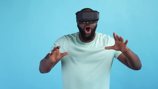 Guy use digital innovation science gadget isolated blue color background — Vídeo de Stock
