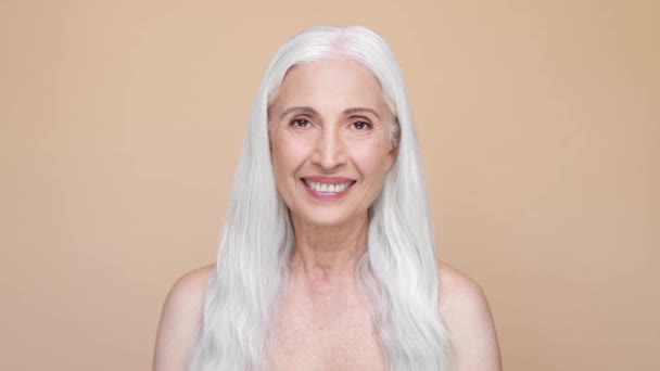 Lady look joyful enjoy dark spots treatment isolated beige color background — стоковое видео