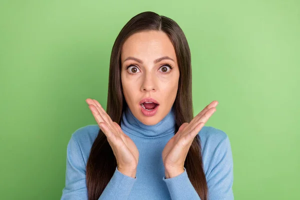 Photo of shocked speechless lady hands cheeks open mouth wear blue turtleneck isolated green color background — Fotografia de Stock