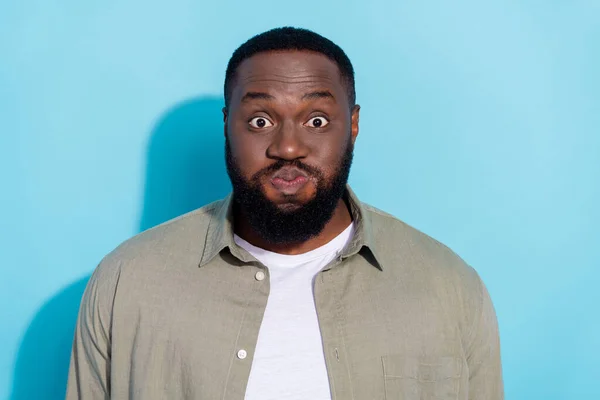 Photo of young african man have fun fool hold breath stupid humorous isolated over blue color background — Stock fotografie