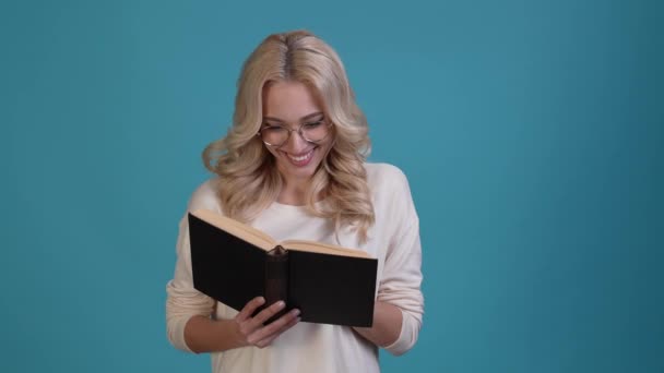 Clever lady read texbook hobby enjoy isolated blue color background — Video