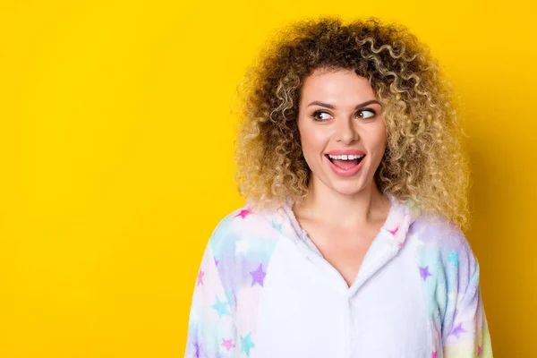 Portrait of attractive cheerful wavy-haired girl thinking copy space good idea isolated over bright yellow color background — Fotografia de Stock