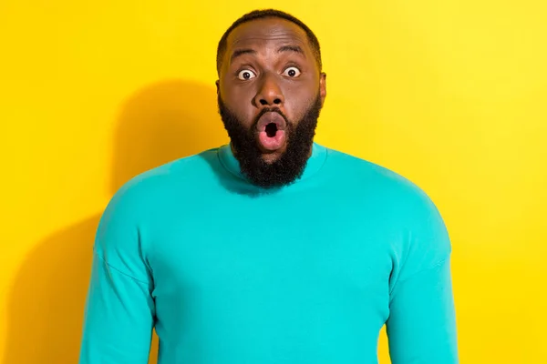 Portrait of astonished person pouted lips staring speechless camera isolated on yellow color background — Zdjęcie stockowe