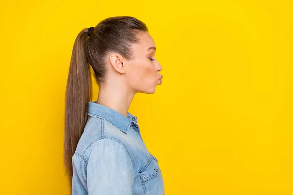 Side profile photo portrait woman sending air kiss on date isolated bright yellow color background copyspace —  Fotos de Stock