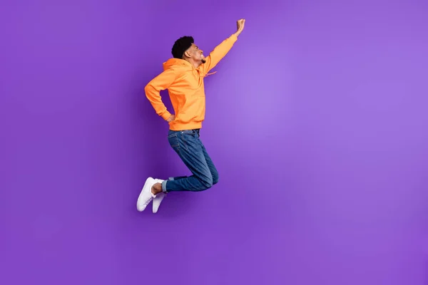 Full length body size view of attractive cheery guy jumping striving success isolated over bright violet purple color background — Stockfoto