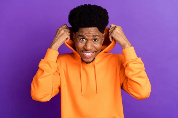 Photo of trend brunet young guy wear orange hoodie isolated on violet color background — Φωτογραφία Αρχείου