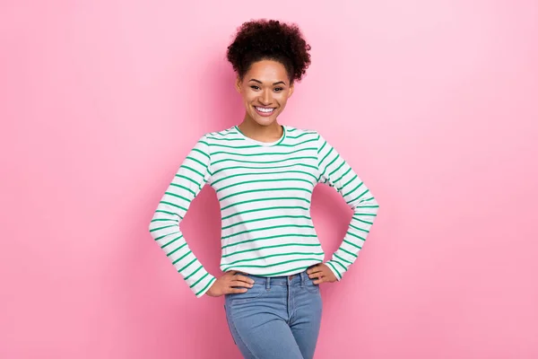 Photo of cute curly hairstyle young lady wear striped shirt jeans isolated on pink color background — Φωτογραφία Αρχείου