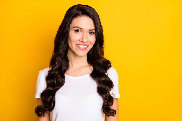 Photo of sweet shiny young woman wear white t-shirt smiling empty space isolated yellow color background — Stock fotografie