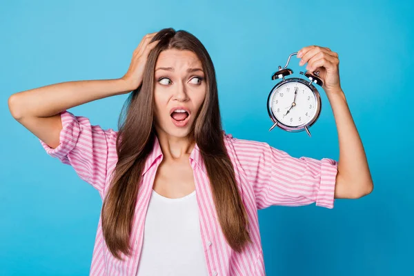 Portrait of impressed brunette lady hold watch hand head wear pink shirt isolated on vivid blue color background — Stock Fotó