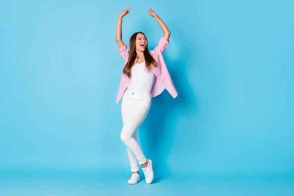 Full size photo of optimistic nice brunette lady dance wear pink shirt trousers sneakers isolated on vivid blue color background — Fotografia de Stock