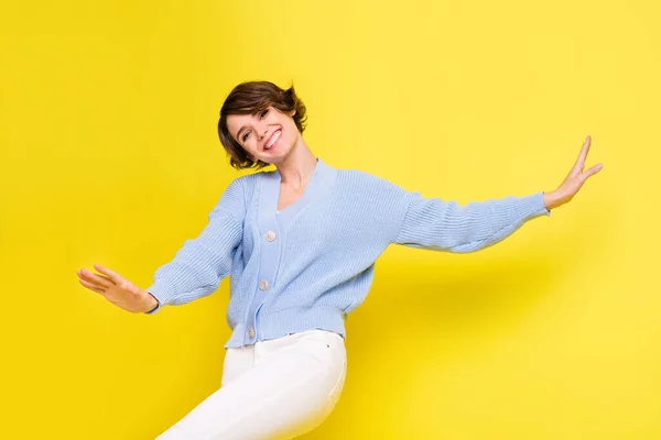 Photo of young cheerful girl happy positive smile have fun good mood isolated over yellow color background — Stock Photo, Image