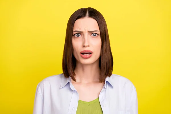 Photo of dislike brunette millennial lady wear blue shirt isolated on yellow color background — Φωτογραφία Αρχείου