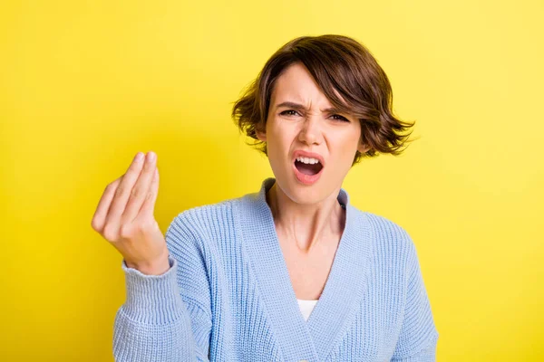 Photo of troubled offended lady raise fingers open mouth wear blue cardigan isolated yellow color background — Zdjęcie stockowe