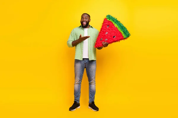 Full size photo of positive cheerful guy arms hold big watermelon collage isolated on yellow color background — Stock Photo, Image