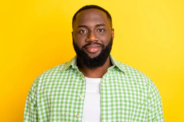 Photo of calm peaceful successful young man look camera isolated on bright vibrant yellow color background — Stock Photo, Image