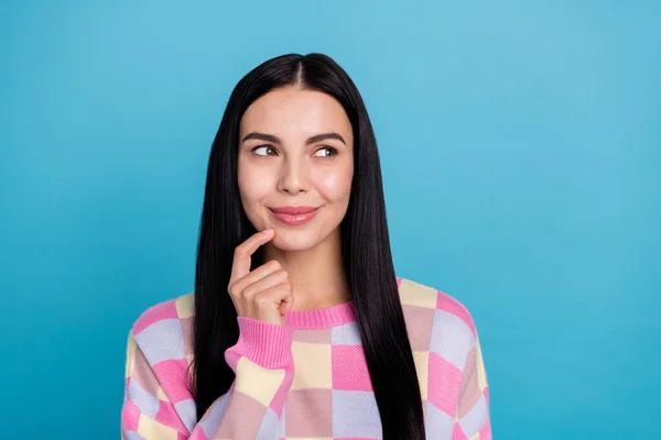 Photo of adorable thoughtful young woman wear pink sweater finger chin looking empty space isolated blue color background — Stock Photo, Image