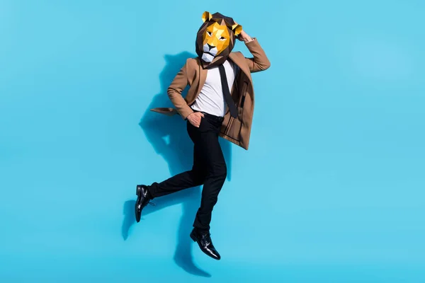Full size photo of authentic guy lion mask jump up crazy freak occasion isolated over blue color background