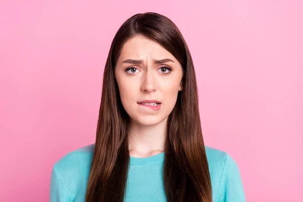 Portrait of attractive worried tired girl biting lip mistrust isolated over pink pastel color background — Stock Photo, Image