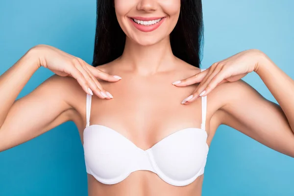 Portrait of cheerful girl beaming smile arms fingers touch chest smearing balm isolated on blue color background — Stock Photo, Image