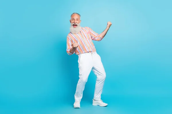 Full size photo of aged man happy positive smile rejoice victory ecstatic lottery isolated over blue color background — Stock Photo, Image