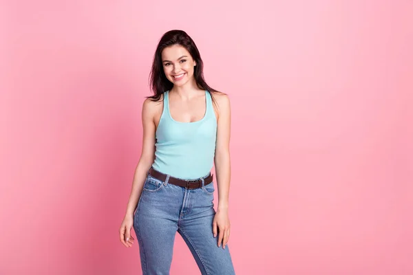 Photo of beauty cool millennial lady stand wear blue top jeans isolated on pink color background — Stock Photo, Image