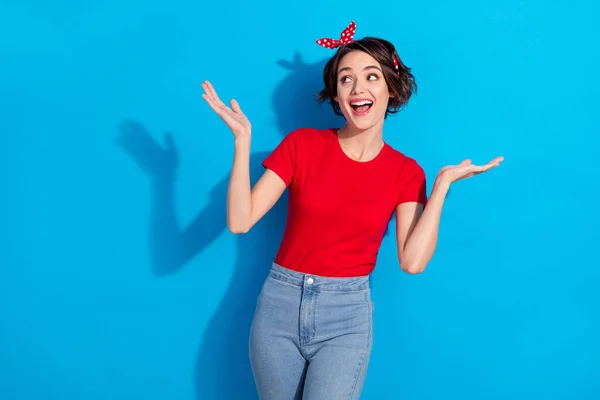 Photo of young pretty girl excited look empty space wear casual outfit isolated over blue color background — Stock Photo, Image