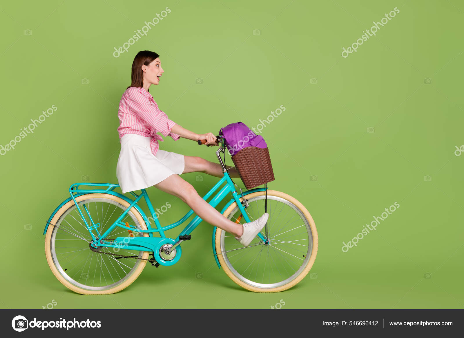 Full size profile side photo of young excited girl extreme riding bicycle  wear casual clothes isolated on green color background Stock Photo by  ©deagreez1 546696412