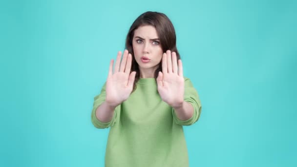 Lady hold hand warn no way against isolated aquamarine color background — Stock Video