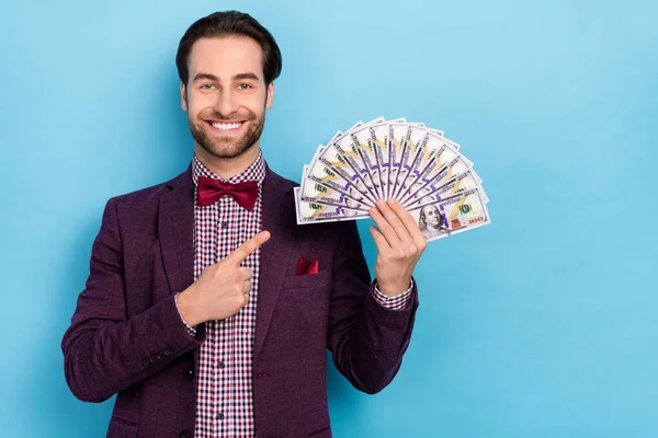 Photo of young rich man indicate finger money recommend promo income salary isolated over blue color background — Stock Photo, Image