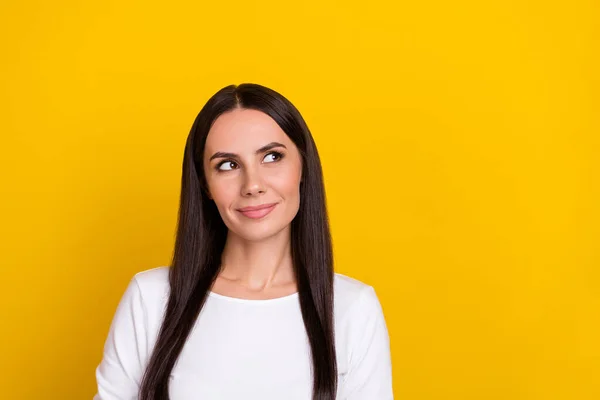 Photo of young woman wonder guess thoughtful plan look empty space isolated over yellow color background — Stock Photo, Image